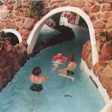 A family enjoys a leisurely swim through a narrow channel at the Tropicano facility in Rotterdam, Netherlands.