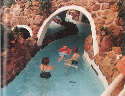 A family enjoys a leisurely swim through a narrow channel at the Tropicano facility in Rotterdam, Netherlands.