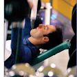 Photo of man lifting weights
