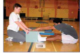 Photo of man taking a sit-and-reach test