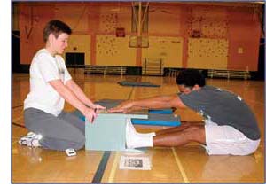 Photo of man taking a sit-and-reach test