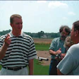 Photo of researcher answering turf-related questions