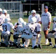 Photo of football coach with team