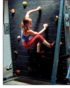 Photo of girl climbing on rotating wall