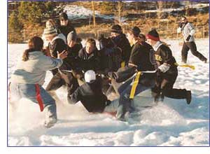 Girls playing football in the snow