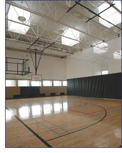 Gym lit by skylights
