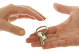 Photo of hands passing a key