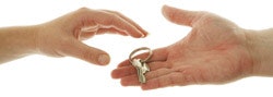 Photo of hands passing a key