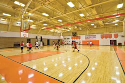 Photo of a hardwood gynasium floor