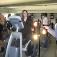 Photo of an OSU student producing electrical power while exercising on an elliptical machine