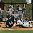 Photo of a baseball player sliding home during a Super Essex Conference game