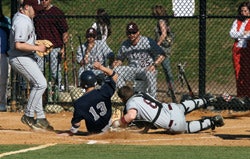 Photo of a baseball player sliding home during a Super Essex Conference game