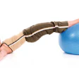 Photo of a woman balancing with her feet on an exercise ball
