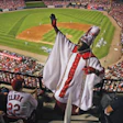 Photo of a St. Louis Cardinal's fan dressed as a Roman Catholic cardinal in the upper levels of Busch Stadium