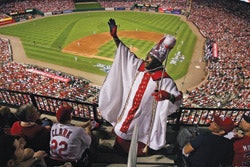 Photo of a St. Louis Cardinal's fan dressed as a Roman Catholic cardinal in the upper levels of Busch Stadium