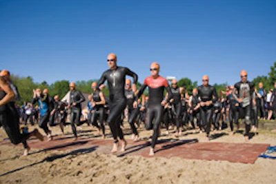 Photo of triathlon entrants crossing time-stamp sensors at the starting line