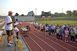 Photo of Coach Bolt speaking to Wichita community residents