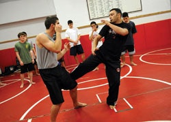 TAKE THAT Around two dozen students participate in Winchester High's MMA club.