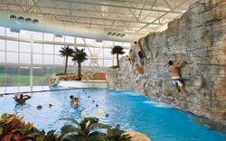 CLIFF NOTES The active pool at the Southeast Missouri State University Aquatic Center features water volleyball, a bouldering wall and a zip line that offers the thrill of whizzing through the air to a splash landing.