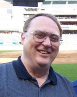Photo of John Salvo who has traveled to see every possible baseball matchup within both the American and National leagues