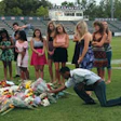 BROKEN HEARTS Students from West High School in Knoxville, Tenn., held a memorial for Jake Logue, a football player from Kingsport South High School who collapsed on West's field during an Aug. 21 game and died of apparent cardiac arrest.