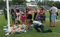 BROKEN HEARTS Students from West High School in Knoxville, Tenn., held a memorial for Jake Logue, a football player from Kingsport South High School who collapsed on West's field during an Aug. 21 game and died of apparent cardiac arrest.