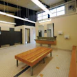 INDOOR/OUTDOOR Through strategic access control and materials selection, the Moody Park Pool locker room in New Westminster, B.C., accommodates pool users throughout the summer, then converts to support athletics programs in an adjacent field house.