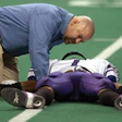 Photo of a football player lying on the turf