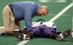 Photo of a football player lying on the turf