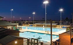 HEAT OF THE NIGHTSolar panels on top of the shade structure keep the pool at Coronado (Calif.) High School's Brian Bent Memorial Aquatics Complex warm enough for after-dark competitions.