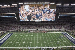 THE BIG HDGigantic video screens suspended from the roof of Cowboys Stadium have become as much a focal point for Dallas fans as the game below.