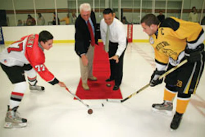 ICE TIME Principals from Cardinal Gibbons High School in Ft. Lauderdale and Western High School in Davie participate in a ceremonial puck drop during Florida's inaugural High School Hockey Night.