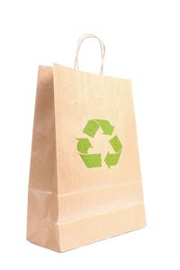 Photo of a shopping bag with the recycle logo printed on the front