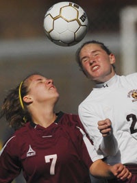 PUTTING HEADS TOGETHER Female soccer players are particularly susceptible to concussions, a trend experts are noting in an effort to reduce catastrophic injuries.