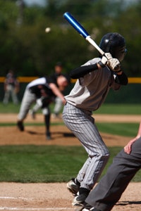 Photo of a batter waiting to swing with a metal baseball bat
