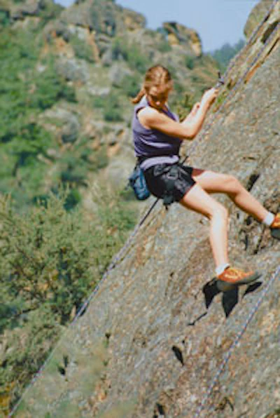 Photo of a student rock climbing