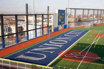 BARRIER GRIEF? School officials might have to add more fencing to keep pop-ups, home runs and field goals from escaping the confines of the third-story stadium.