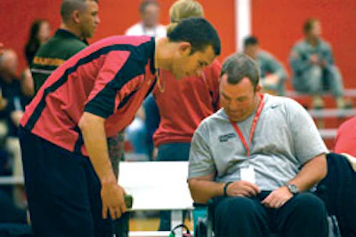 Photo of a Warrior Games wheelchair basketball athlete and coach