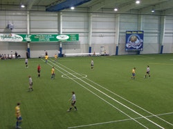 WIDE OPEN An advantage of boardless soccer is that players can practice their throw-ins and touch-line ball handling just as they would on an outdoor field.