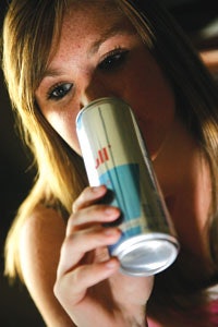 Photo of a girl consuming an energy drink