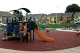 Photo of a playground using recycled rubber pavers