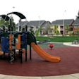 Photo of a playground using recycled rubber pavers