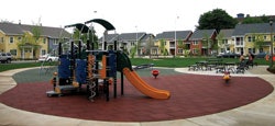 Photo of a playground using recycled rubber pavers