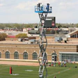ABOVE THE FRAY Long used by a majority of college football programs to shoot practice video, scissor lifts have recently become the focus of safety concerns.