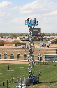 ABOVE THE FRAY Long used by a majority of college football programs to shoot practice video, scissor lifts have recently become the focus of safety concerns.