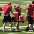 SUPERVISED DRINKING McMinnville (Ore.) High School football players are shown hydrating just days after 19 of the team's players were diagnosed with rhabdomyolysis during a summertime training session that was unregulated by the state athletic association.