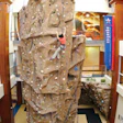 Photo of a woman scaling a large climbing wall