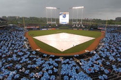 ROYAL TREATMENT Keeping rain off infields, like the one at Kansas City's Kauffman Stadium, is just one of the tasks ably handled by field covers.