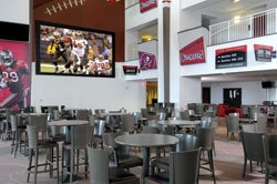HOME THEATER A video wall inside Tampa's Raymond James Stadium club level allows fans to catch virtually every minute of Buccaneers action.