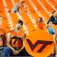 Photo of Virginia Tech football fans amid a number of empty seats at the Orange Bowl